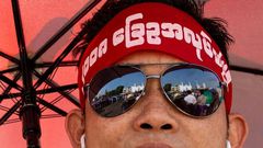 The rally drew hundreds wearing headbands and T-shirts calling for reform of the military-scripted constitution