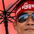 The rally drew hundreds wearing headbands and T-shirts calling for reform of the military-scripted constitution