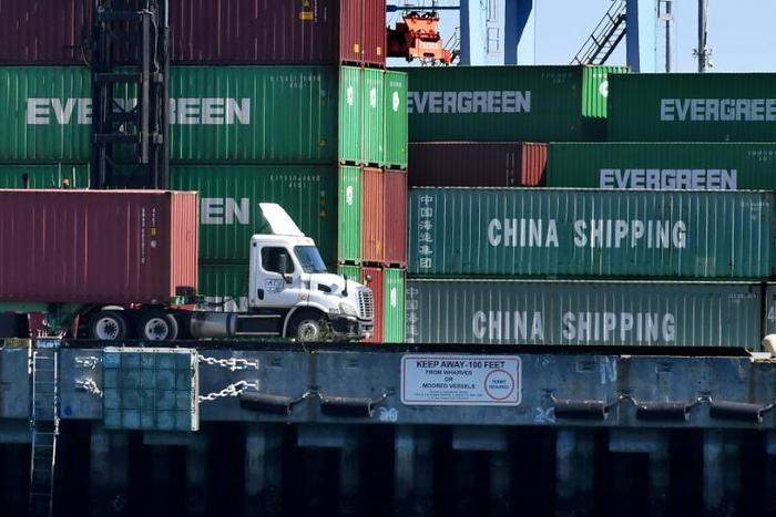 Shipping containers from China and other nations are unloaded at the Long Beach Port in Los Angeles, California; the US and China will resume talks aimed at ending a damaging trade war from Tuesday