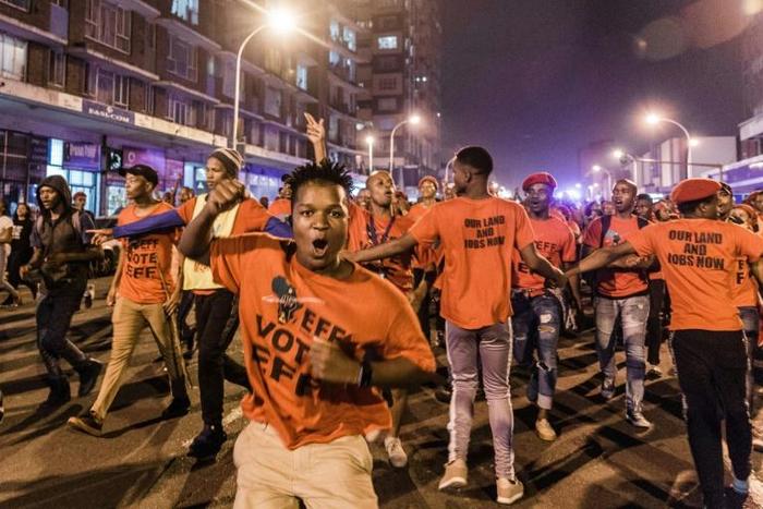 Hundreds of supporters of the opposition radical-left EFF party march in Durban on the eve of the election