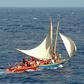 This image released 27 February 2004 by the US Coast guard shows an overloaded Haitian migrant vessel (R) being located by the US Coast Guard (L) in the Windward Pass, between Haiti and eastern Cuba