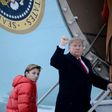 US President Donald Trump says he would not encouragae his son Barron, seen here boarding Air Force One with his father, to play American football