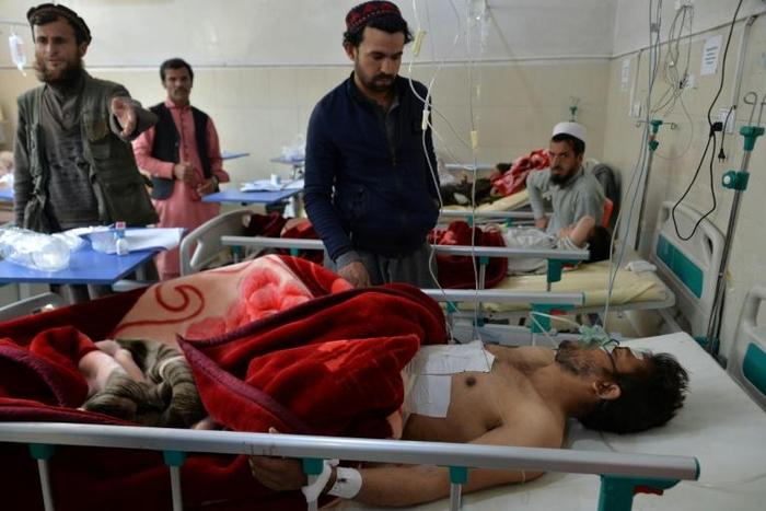 Afghan victims receive medical treatment at a hospital following a suicide attack on a private construction company in Jalalabad Wednesday