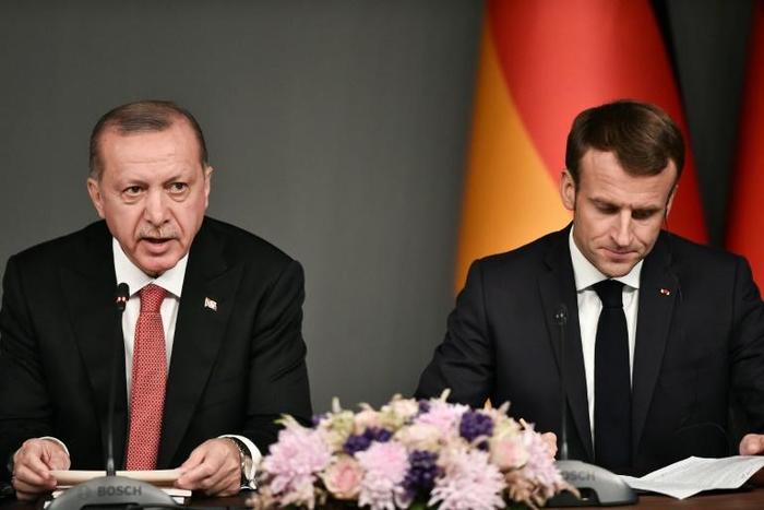 Turkish President Recep Tayyip Erdogan (L, pictured October 2018) told French President Emmanuel Macron he was "still a political noice" and should "first learn the history of [his] country"