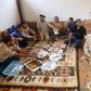 Fighters loyal to Libya's internationally-recognised Government of National Accord (GNA) prepare an Iftar meal south of Tripoli