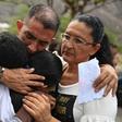 Gilberto Altuve (C), father of 11-year-old boy Erick Altuve, who died of cancer while waiting for a bone marrow transplant in Venezuela, mourns during his funeral