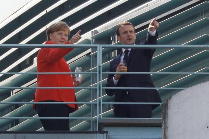 German Chancellor Angela Merkel and French President Emmanuel Macron are hosting bitter foes Serbia and Kosovo for talks