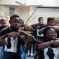 Xolani Zingeni (centre) is one of dozens of youngsters from South Africa to study an instrument at Buskaid, a school specifically for black township children