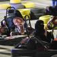 Saudi women attend an electronic driving simulator during a go-cart driving workshop for women in the capital Riyadh