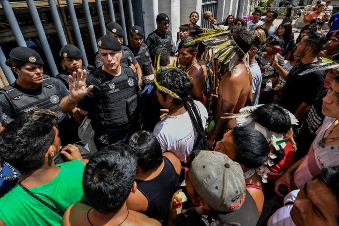 Brazilian indigenous people (Guarani pictured March 2019 protesting their healthcare conditions in Sao Paulo) warned that since Bolsonaro's election, "we are experiencing the first stages of an apocalypse"