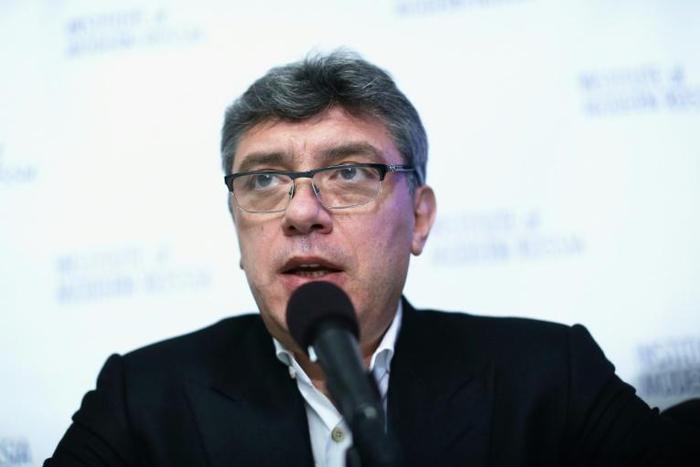 Russian opposition leader Boris Nemtsov airs allegations of corruption at the Sochi Olympics during a 2014 news conference in Washington -- a year before he was killed in Moscow