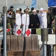 A handout picture provided by Iran's presidency on February 17, 2019, shows Hassan Rouhani (dressed in black) during the unveiling of the country's first semi-heavy submarine at Bandar Abbas naval base