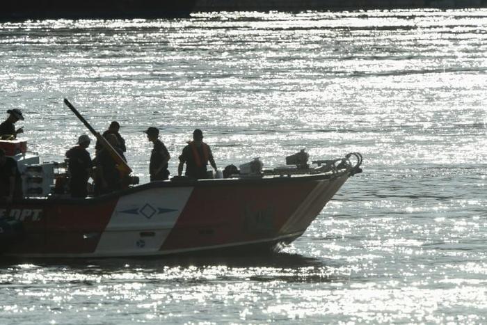 Hungarian rescue workers continue to search for the missing boat passengers