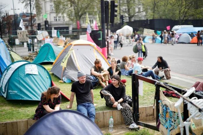 Climate change activists at the Extinction Rebellion group's environmental protest camp in Marble Arch central London where they are regrouping after blocking some of the capital's business thoroughfares