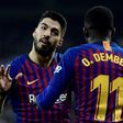 Man of the moment: Barcelona forward Luis Suarez celebrates with Ousmane Dembele