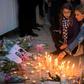 Moroccans lit candles and laid flowers in memory of murdered hikers Louisa Vesterager Jespersen and Maren Ueland after their killing in December