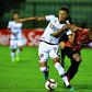 Leonardo Miffin of Peru's Melgar (left) and Carlos Espinoza of Venezuela's Caracas vie for the ball during their Copa Libertadores match at the Olympic Stadium in Caracas on February 26, 2019