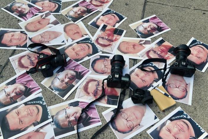 Pictures of journalists murdered in Mexico are displayed during a May 2017 protest in Mexico City