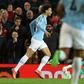 Manchester City's Leroy Sane (left) celebrates scoring his team's second goal against Manchester United