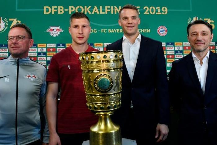 Leipzig coach Ralf Rangnick and his captain Willi Orban posed with the German cup alongside Bayern captain Manuel Neu and coach Niko Kovac