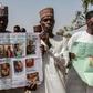 Parents and relatives hold portraits of their girls during a commemoration five years after they were abducted by Boko Haram Jihadists who stormed the Chibok girls' boarding school