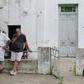 Friends and neighbors console Emiliano Sala's father Horacio Sala (2-R) in front of his house in Progreso, Santa Fe province, Argentina