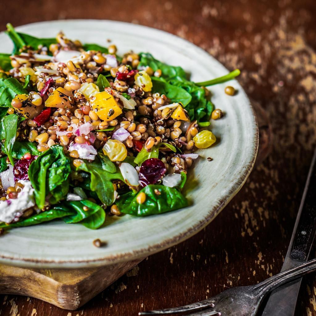 Healthy salad with spinach,quinoa and roasted vegetables