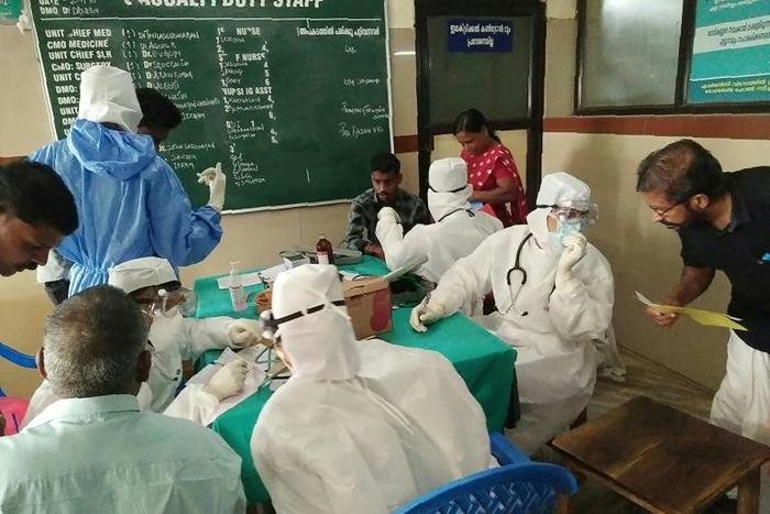 Medics wearing protective suits check patients for the Nipah virus in 2018 when 17 people died from the disease