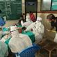 Medics wearing protective suits check patients for the Nipah virus in 2018 when 17 people died from the disease