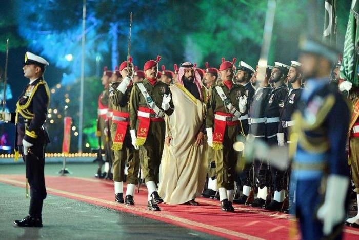 Saudi Arabian Crown Prince Mohammed bin Salman reviews a guard of honour at the Pakistan Prime Minister's House in Islamabad. Pakistan has rolled out the red carpet for the Saudi royal in exchange for economic deals worth over $20 billion