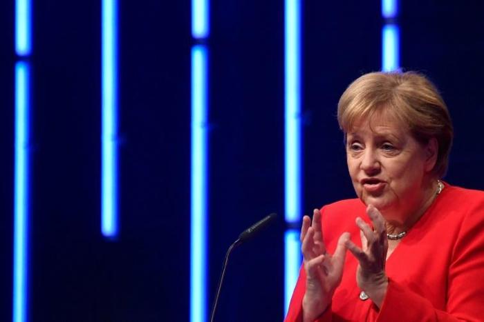 GMerkel responded to Federation of German Industry criticism over "faint-hearted" policies by firing a salvo at the car industry over the emissions scandal