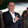 Brazil's President-elect Jair Bolsonaro (L), pictured at a graduation ceremony November 24, 2018, is embroiled in a crisis over campaign financing