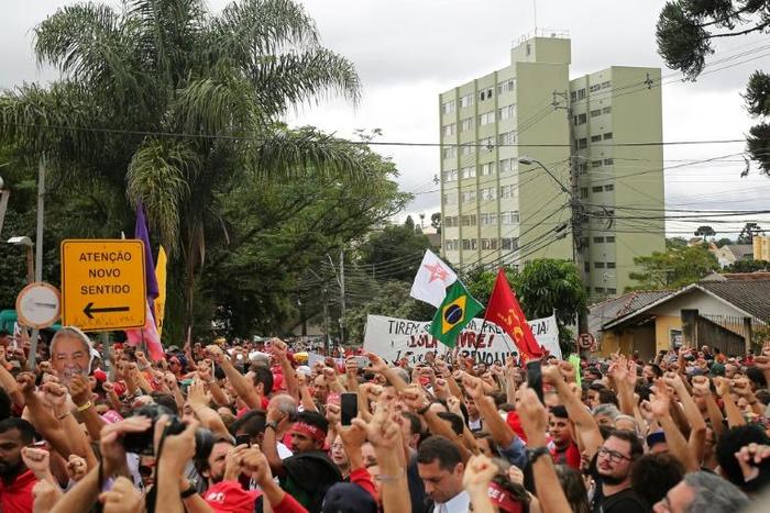 Supporters of former Brazilian president Luiz Inacio Lula da Silva rally outside his cell on April 7, 2019 to mark his first year in prison