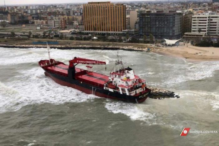 This aerial framegrab from the Italian Coast Guards shows a Turkish-flagged cargo ship after it ran ashore on a beach in Bari due to bad weather conditions