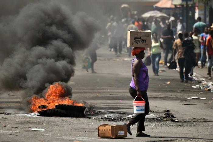 Tires set alight by protesters burn in Port-au-Prince Haiti, on February 17, 2019