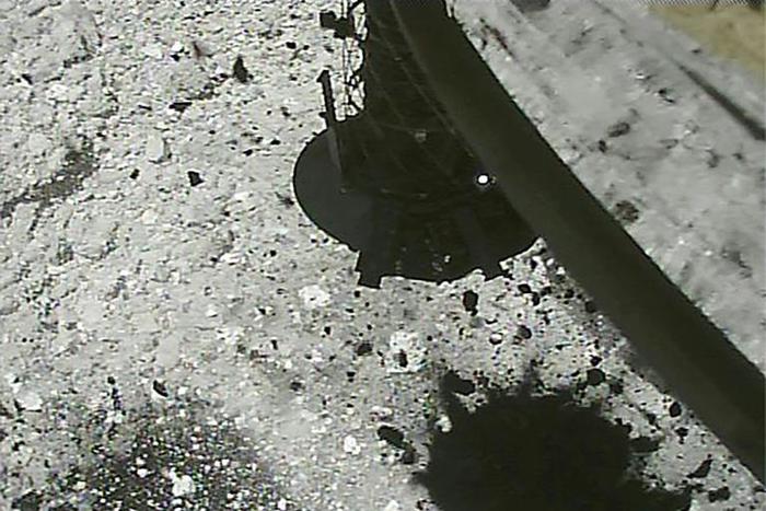 Stone and sand were thrown up on the Ryugu asteroid after Hayabusa2 fired a bullet into the surface in February to puff up dust for collection