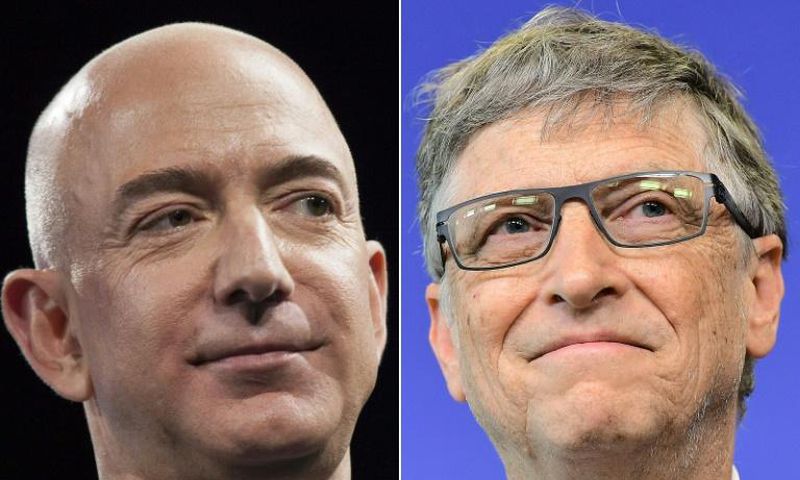 Amazon founder Jeff Bezos (L) and Microsoft co-founder Bill Gates are the richest persons in the world, according to Forbes