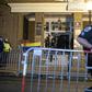 Policemen move barriers as federal agents open the door of the Venezuelan Embassy in Washington occupied by activists supporting Venezuelan leader Nicolas Maduro on May 13, 2019