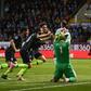 Inching ahead: Manchester City's Sergio Aguero (right) celebrates his vital winner at Burnley