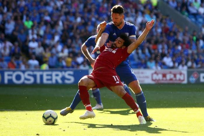 Going down: Liverpool's Egyptian midfielder Mohamed Salah is fouled by Cardiff defender Sean Morrison and a penalty is awarded