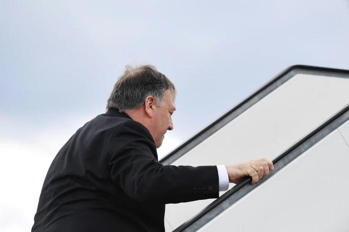 US Secretary of State Mike Pompeo boards a plane as departs Finland after speaking in an Arctic Council meeting, and after abruptly cancelling a visit to Germany