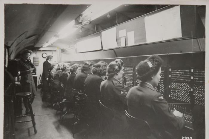 A reproduction of a black and white photograph taken in 1944 and shown to AFP by former D-Day switchboard operator Marie Scott, shows women at work in the tunnels at Fort Southwick in Portsmouth, southern England.