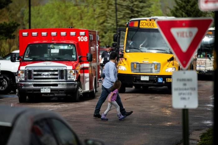 Students are evacuated from the Recreation Center at Northridge in Highlands Ranch after a shooting at the STEM School Highlands Ranch on May 7, 2019