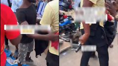 Police officer slaps alleged thief with gun during confrontation at Adum