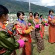 Bhutanese schoolgirls practice a dance. Teachers in the Himalayan kingdom will see a pay rise of 100 percent and allowances