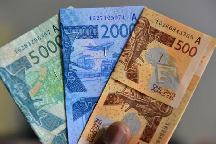Some economists urge West Africa to hold on to national currencies
