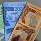 Some economists urge West Africa to hold on to national currencies