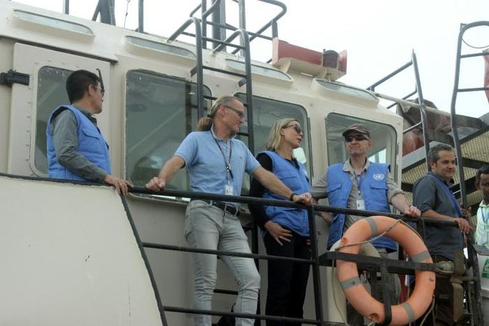 UN monitors hold a joint meeting with representatives of the Yemeni government and the Huthi rebels on a vessel off the coast of the Yemeni port city of Hodeida on July 14, 2019.