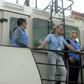 UN monitors hold a joint meeting with representatives of the Yemeni government and the Huthi rebels on a vessel off the coast of the Yemeni port city of Hodeida on July 14, 2019.