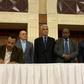 The deputy chief of Sudan's ruling miliary council Mohamed Hamdan Dagalo (R) and protest leader Ahmed al-Rabie (L) initial an agreement before AU and Ethiopian mediators in Khartoum early on Wednesday